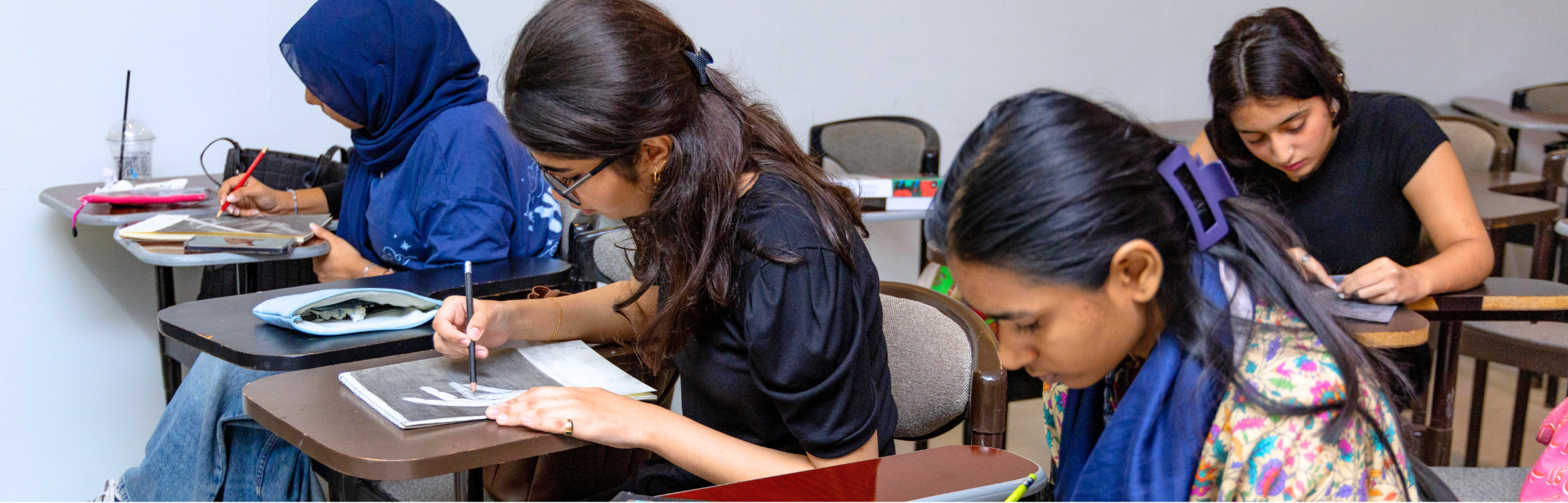 Cedar College students working at their desks